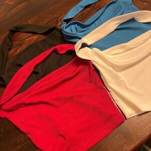 Set of 4 halter crop tops- black, red, white, and blue.